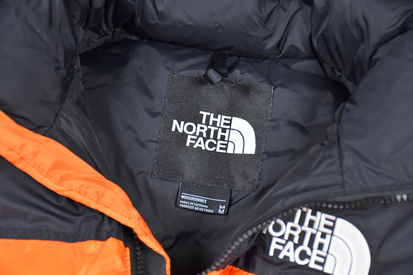 the n0*h f**e t*f 1996 down jacket orange