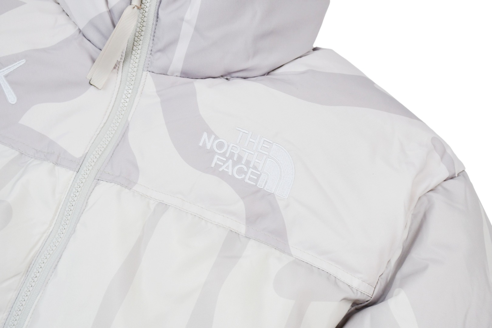 kaws x the n0*h f**e t*f 1996 down jacket