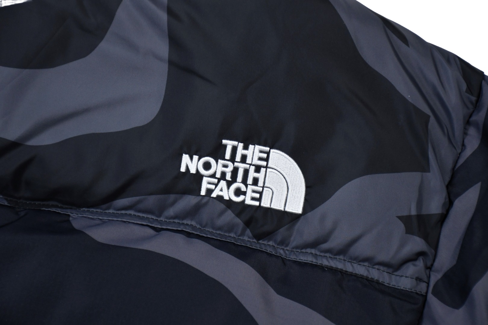 kaws x the n0*h f**e t*f 1996 down jacket